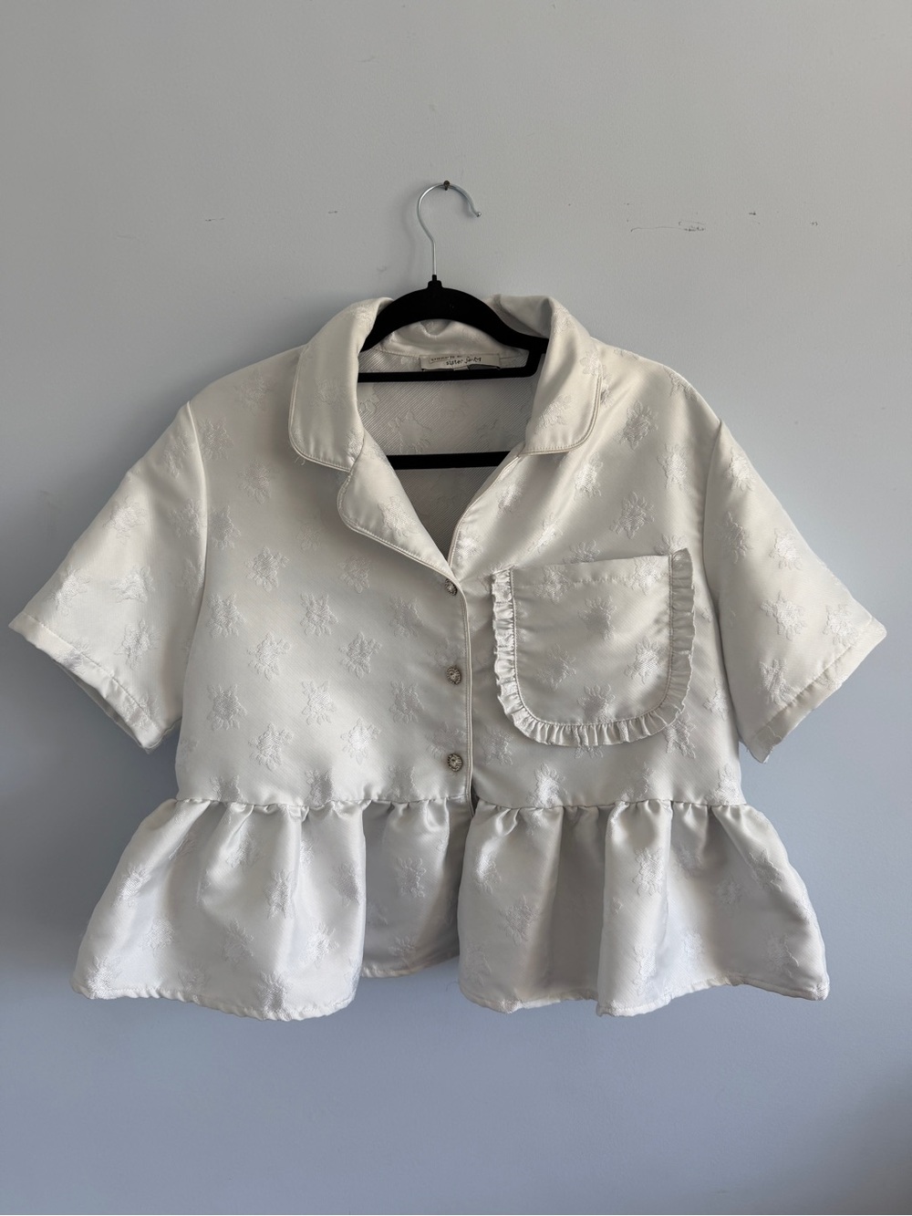 Sister Jane Ivory Short Sleeve Peplum Ruffle Pocket Button-Down